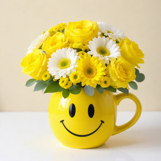 Deluxe size cheerful yellow bouquet with roses, daisies, and mixed flowers arranged in a yellow smiley mug — fresh flowers Oceanside CA.