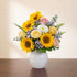 Full size birthday bouquet with fuller sunflowers, additional pink roses, white button mums, soft filler flowers, and lush greenery in a white ceramic vase – Vista florist.