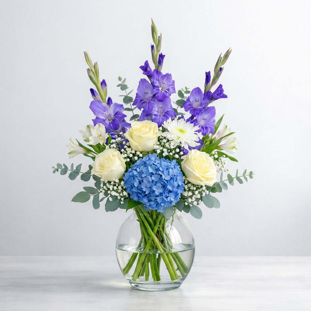 Blue and white flower vase arrangement with elegant blooms