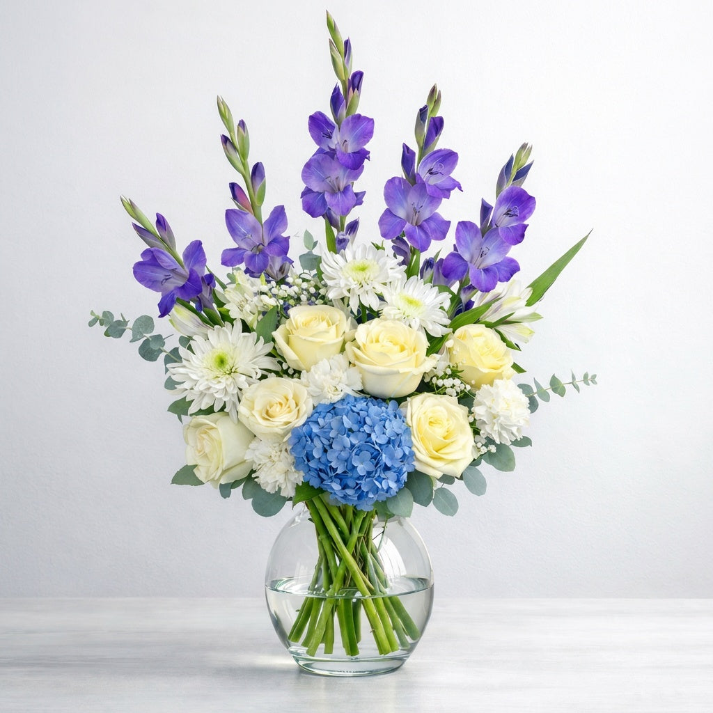 Blue and white flower vase arrangement with elegant blooms