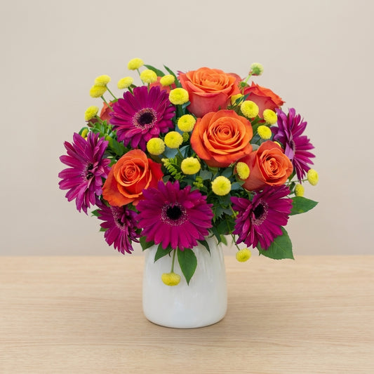 Full size Sunset Spark regular size vase arrangement with orange roses and pink gerbera daisies, Carlsbad flower delivery.
