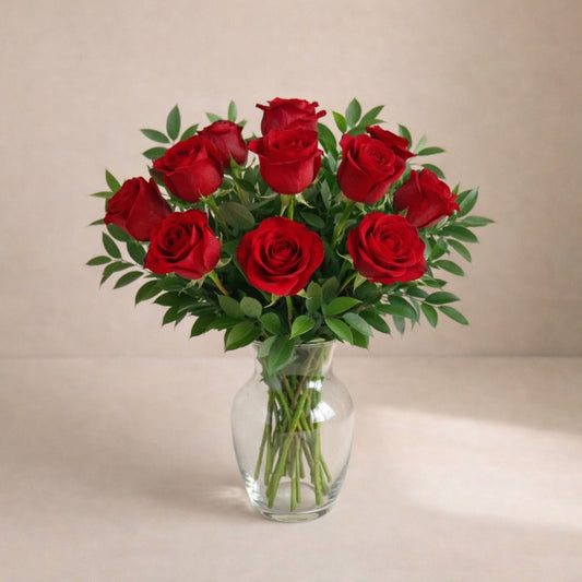 Classic red rose vase arrangement with Italian ruscus greenery, handcrafted floral design in a clear glass vase – Encinitas flower delivery