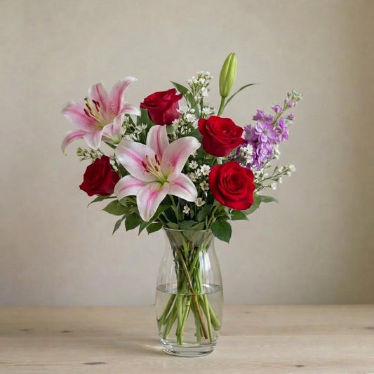 Elegant Harmony bouquet with pink lilies, red roses and purple blooms in a tall glass vase, regular size, flower delivery in Encinitas