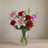 Elegant Harmony bouquet with pink lilies, red roses and purple blooms in a tall glass vase, regular size, flower delivery in Encinitas