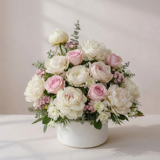 White and blush peony rose vase arrangement with mums, lilies, and mini carnations, styled in a white ceramic vase - San Marcos flower delivery.