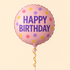 Pink round Mylar balloon with “Happy Birthday” text and colorful polka dots.