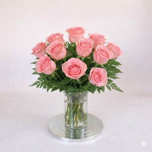 12 pink rose arrangement in a clear glass vase – San Marcos flower delivery