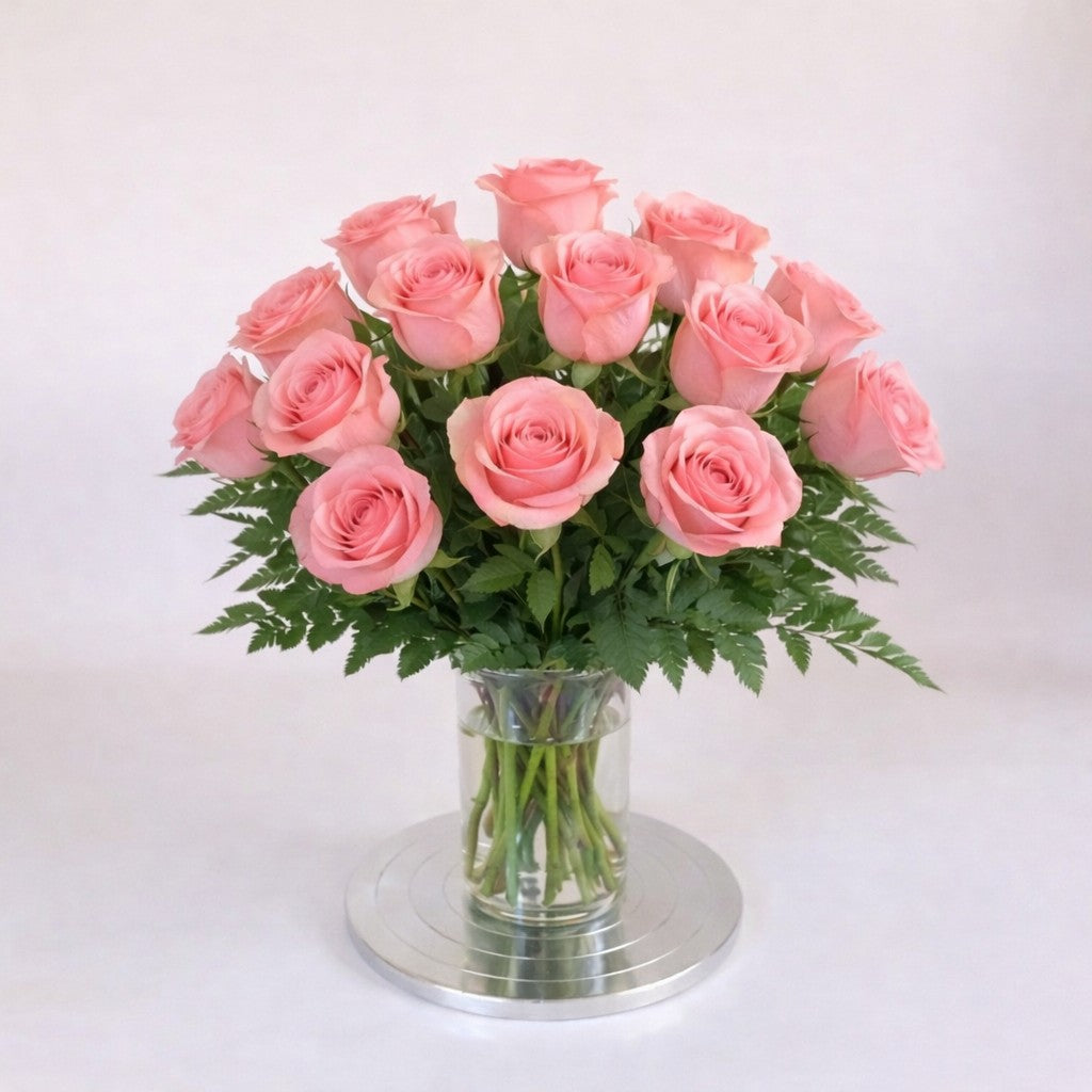 18 pink rose arrangement in a clear glass vase – handcrafted local flower delivery