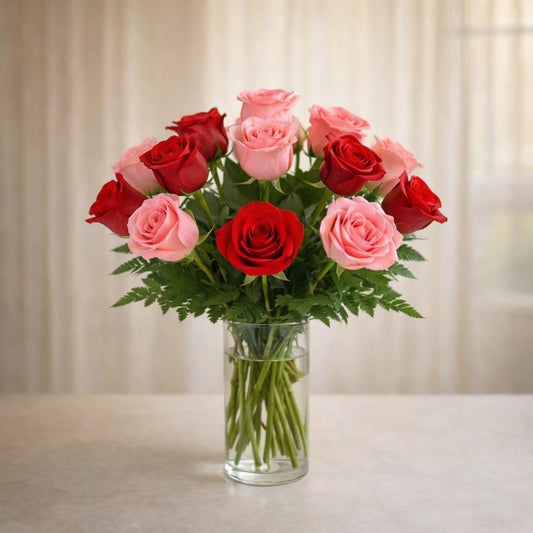 Regular size mixed rose bouquet with red, pink, and cream roses, eucalyptus, and soft greenery in a clear glass vase – Fresh flowers San Marcos CA.