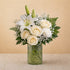 Regular size Serenity Grace white sympathy arrangement featuring white lilies, ivory roses, chrysanthemums, and soft greenery in a clear glass vase — Escondido florist.