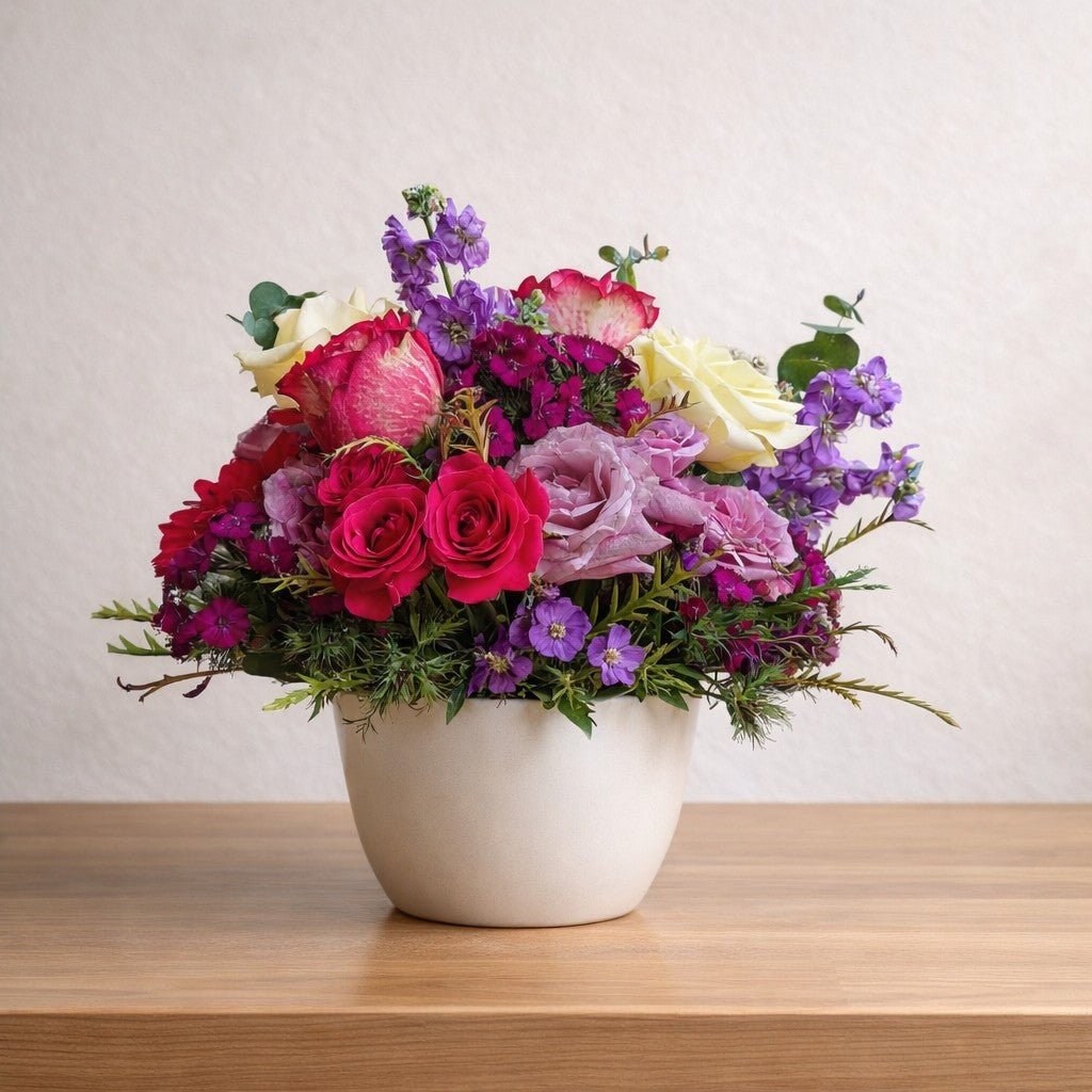 Mixed rose and gerbera arrangement with vibrant garden flowers