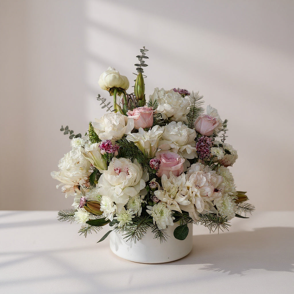 White and blush peony rose vase arrangement with mums, lilies, and mini carnations, styled in a white ceramic vase - San Marcos flower delivery.