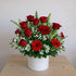 Red rose lily and gerbera arrangement with vibrant red flowers
