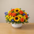 Rose and gerbera bowl arrangement with bright colorful flowers