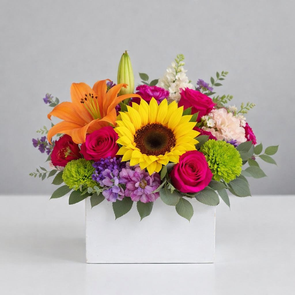 Extra full size sunflower and orange lily flower arrangement with pink roses, green mums and seasonal blooms in white container – Carlsbad flower delivery