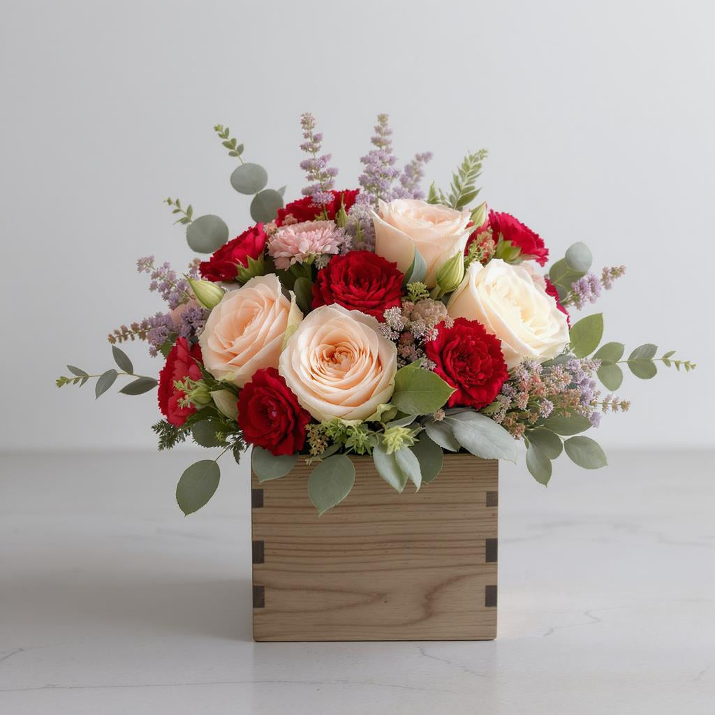 Regular size peach and red rose wooden box arrangement with greenery and filler flowers on a white background – Same-day flower delivery Oceanside.