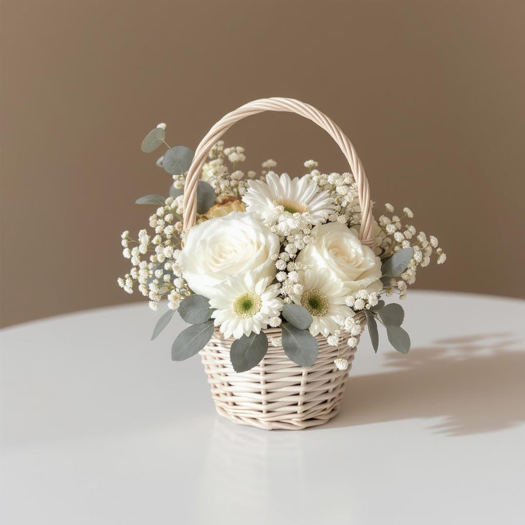 Regular size white floral basket arrangement with roses, daisies, baby’s breath, and eucalyptus in a woven basket — Same-day flower delivery Oceanside.