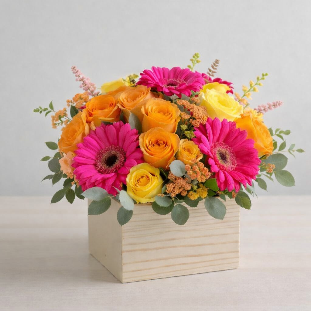 Gerbera and rose box arrangement with bright colorful flowers
